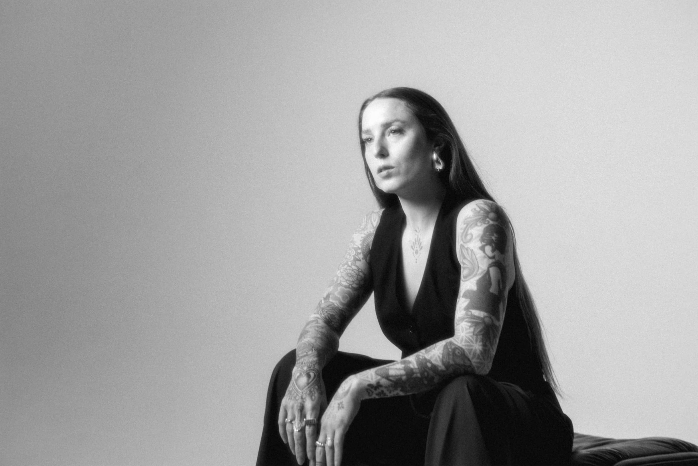 Photo of Libby Reese sitting. Black and white.